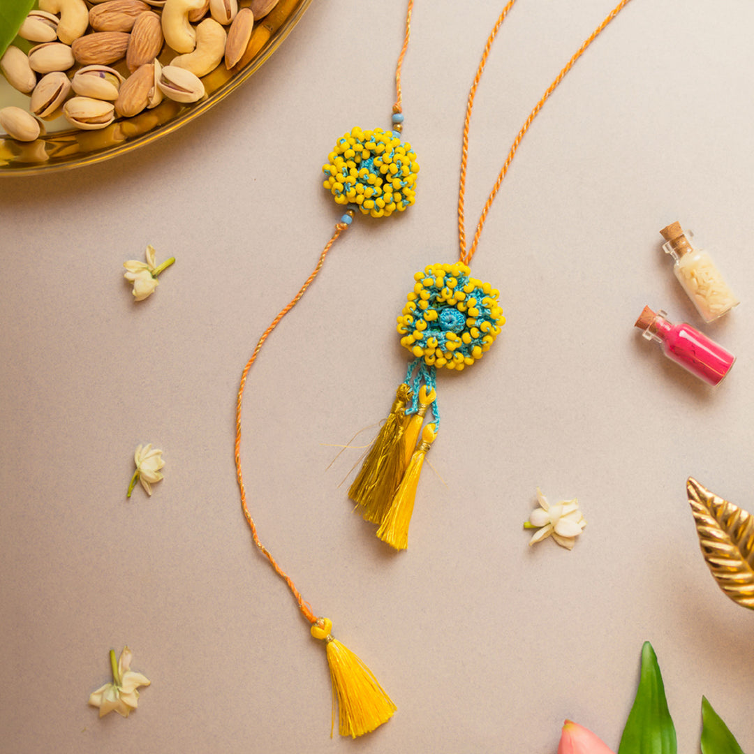 Intricate Crochet Yellow Coral Bhaiya Bhabhi Rakhi-Lumba Set With Roli Chawal | Set of 2