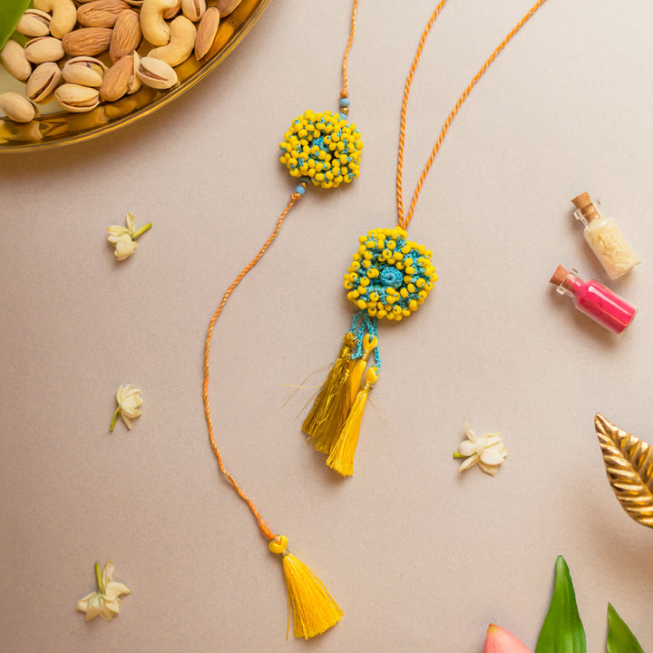 Intricate Crochet Yellow Coral Bhaiya Bhabhi Rakhi-Lumba Set With Roli Chawal | Set of 2