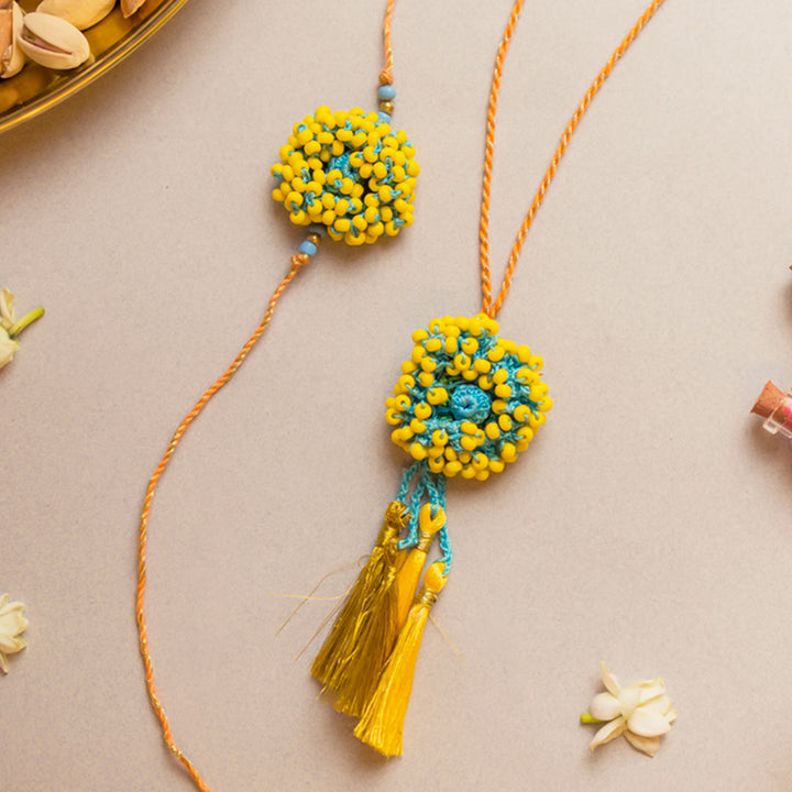 Intricate Crochet Yellow Coral Bhaiya Bhabhi Rakhi-Lumba Set With Roli Chawal | Set of 2