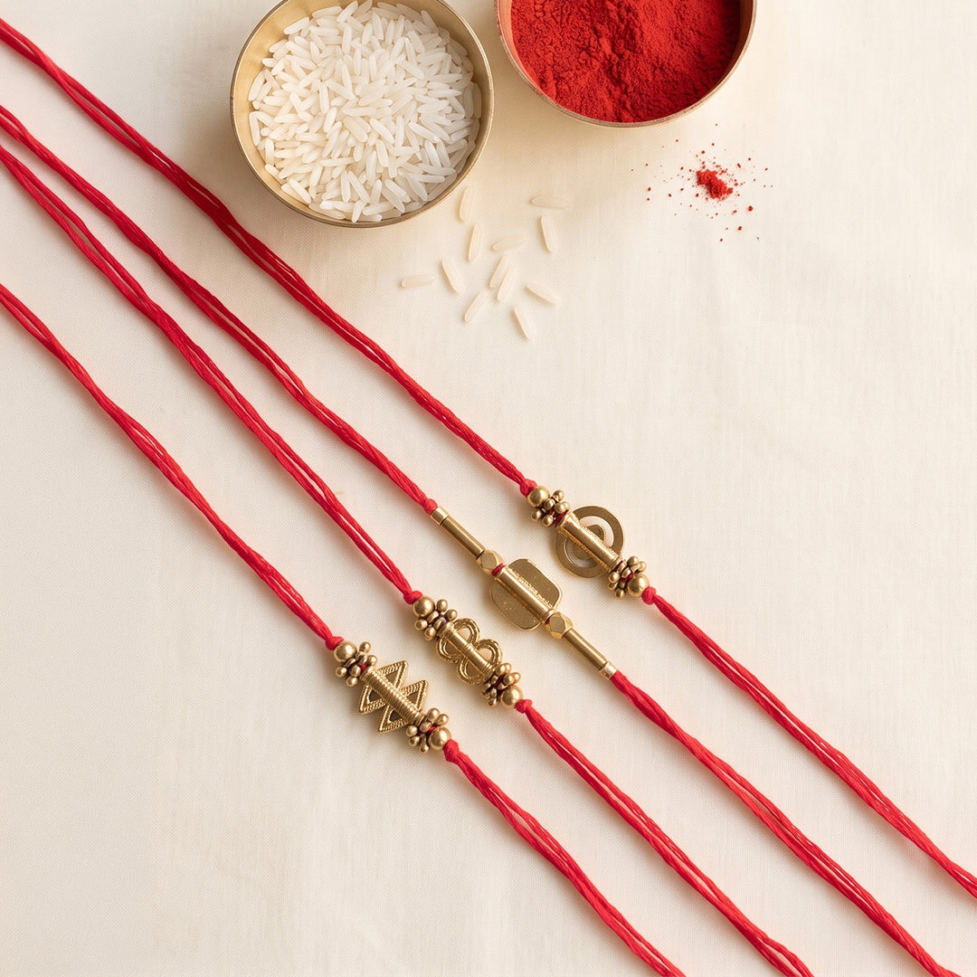 Beaded Shield & Bloom Brass Rakhi With Roli Chawal For Brother | Set of 4