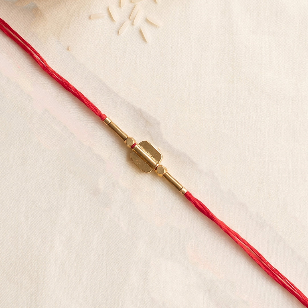Beaded Shield & Bloom Brass Rakhi For Brother
