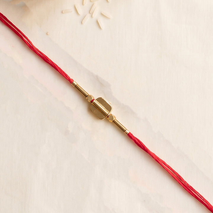 Beaded Shield & Bloom Brass Rakhi For Brother
