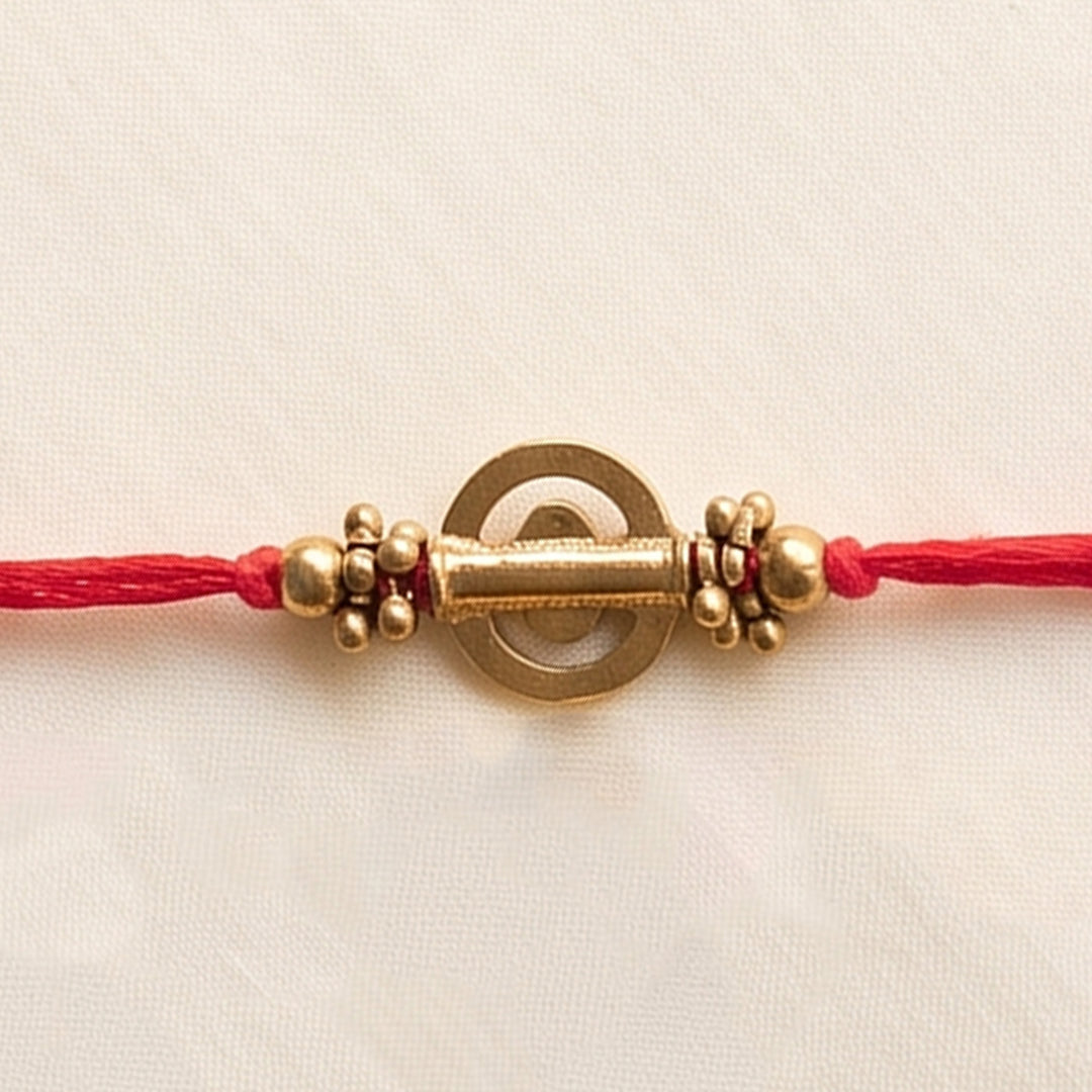 Beaded Shield & Bloom Brass Rakhi For Brother