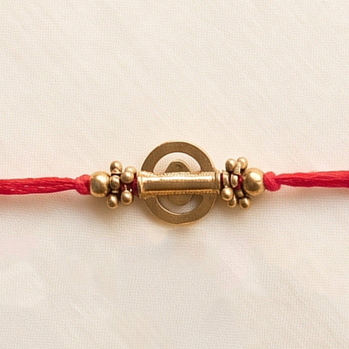 Beaded Shield & Bloom Brass Rakhi For Brother