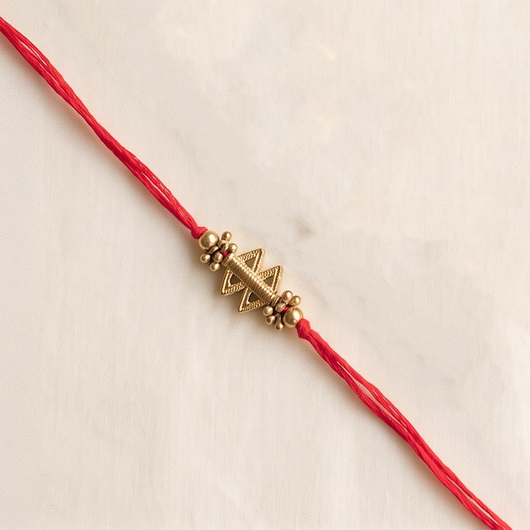 Beaded Shield & Bloom Brass Rakhi For Brother