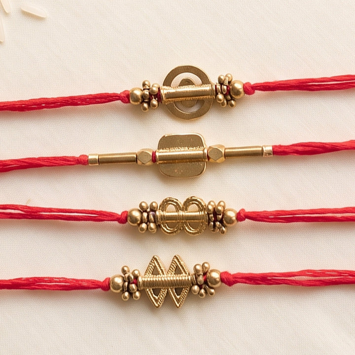 Beaded Shield & Bloom Brass Rakhi With Roli Chawal For Brother | Set of 4