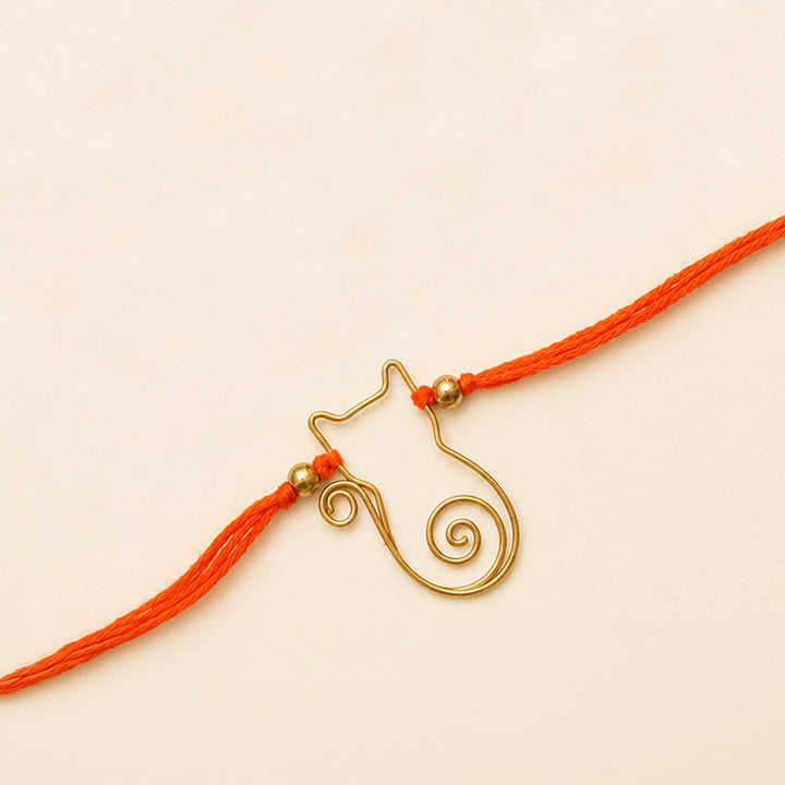 Handcrafted Wired Brass Charm Rakhi With Roli Chawal For Brother