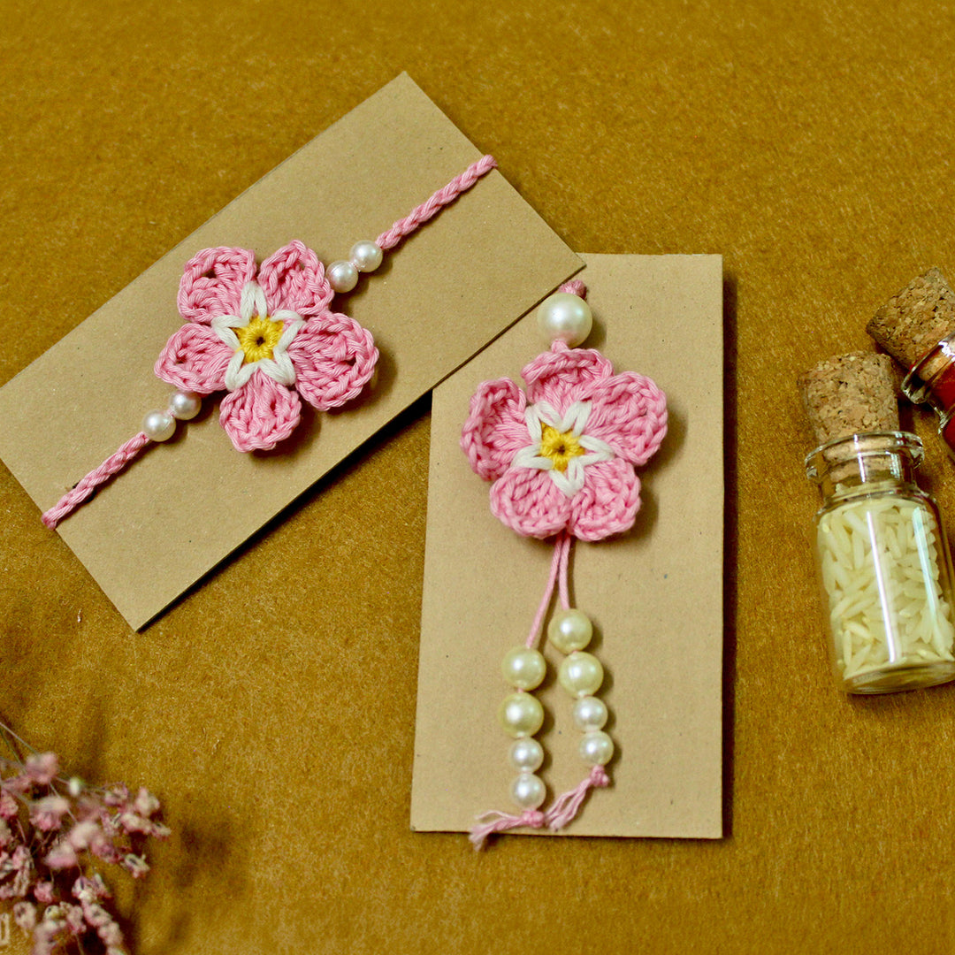 Handmade Crochet Cherry Blossom Couple Rakhi Lumba Set With Roli Chawal for Bhaiya Bhabhi | Set Of 2