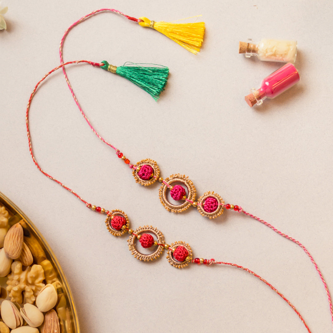Intricate Beaded Crochet Sacred Loop Rakhi With Roli Chawal | Set of 2