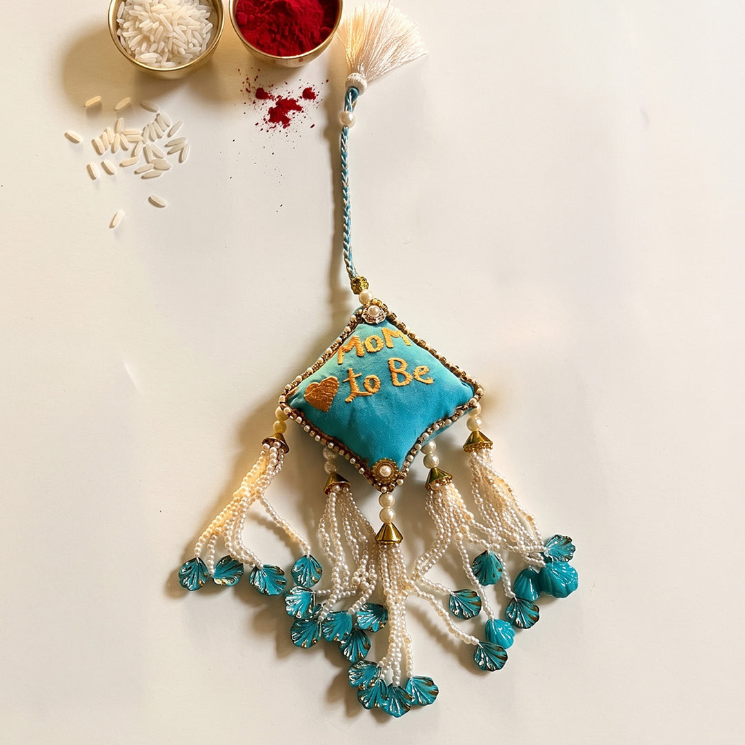 Mom-to-Be Ceramic Rakhi Hamper With Rakhi & Festive Cards For Sister