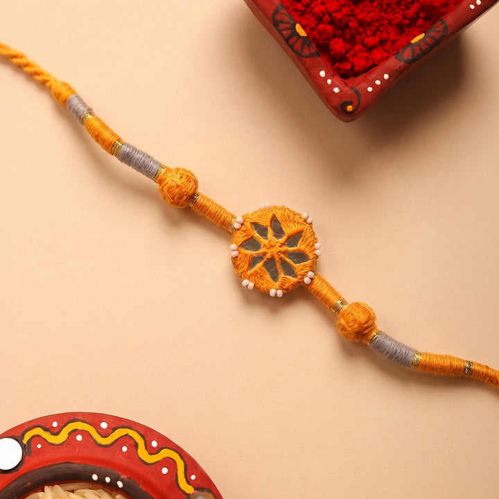 Handmade Mirror Work Patwa Ochre Cotton Rakhi With Roli Chawal
