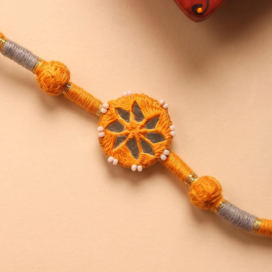 Handmade Mirror Work Patwa Ochre Cotton Rakhi With Roli Chawal