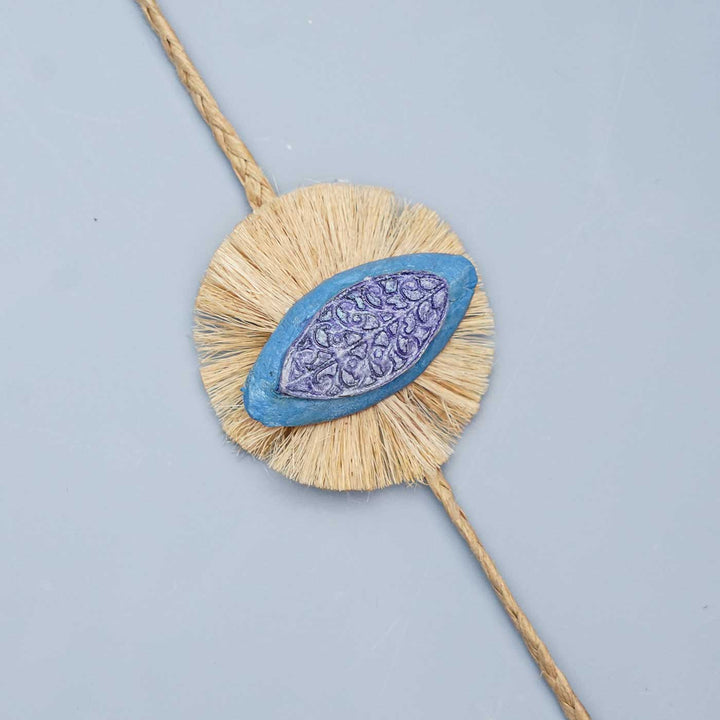 Handmade Papier Mache Naquashi Blue Rakhi With Roli Chawal - Close-up of decorative element