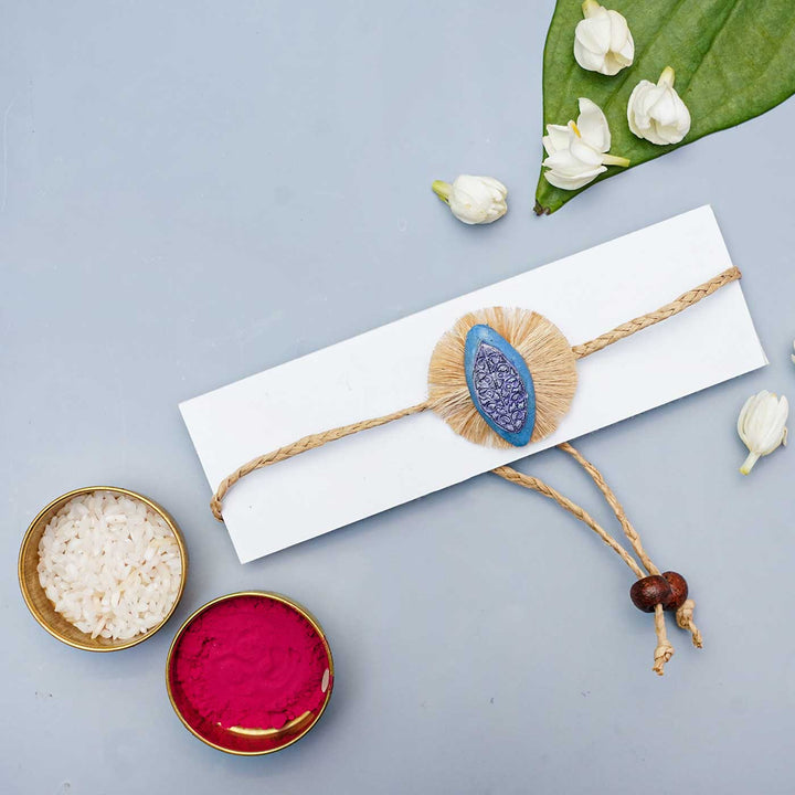 Handmade Papier Mache Naquashi Blue Rakhi With Roli Chawal - Packaged with ceremonial items