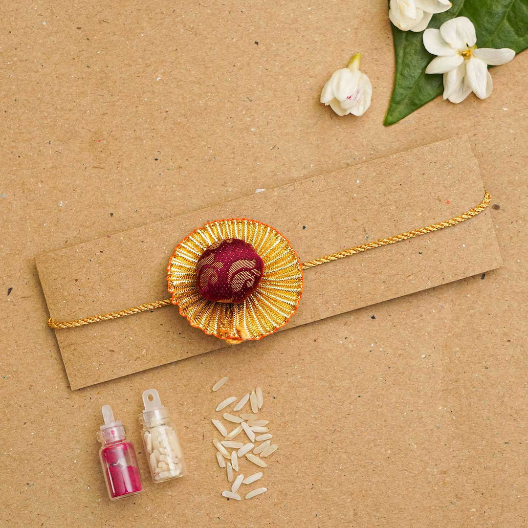 Handmade Pom Pom Khan Silk Rakhi With Chocolates & Roli Chawal
