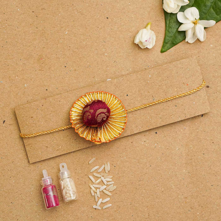 Handmade Pom Pom Khan Silk Rakhi With Chocolates & Roli Chawal