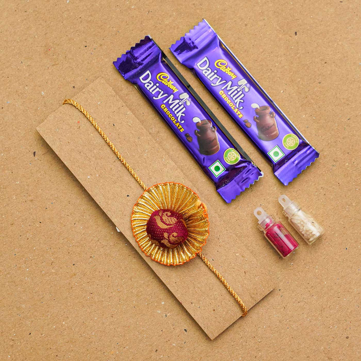 Handmade Pom Pom Khan Silk Rakhi With Chocolates & Roli Chawal