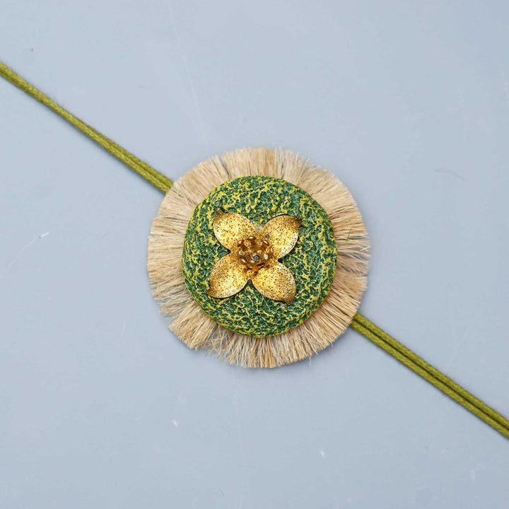 Handmade Papier Mache Floral Green Rakhi With Roli Chawal - Close-up of Rakhi Design