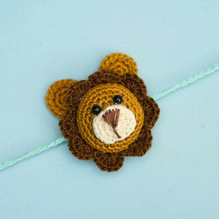 Handmade Crochet Lion Cub Kids Rakhi With Roli Chawal - Close-up Front View