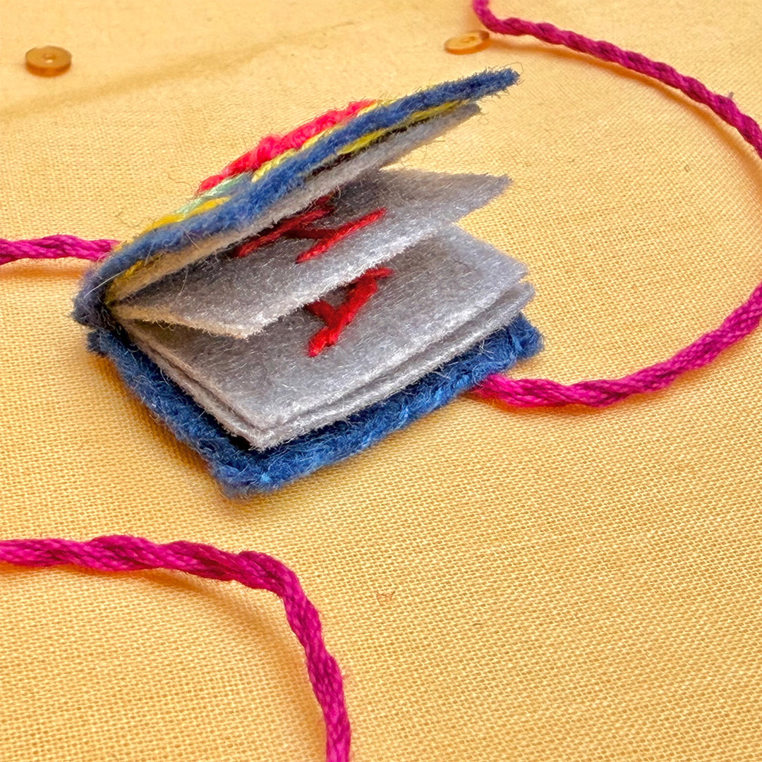 Hand Embroidered Book Rakhi With Keychain For Brother