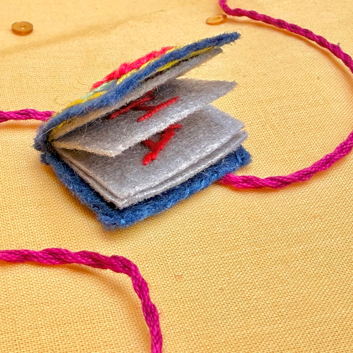 Hand Embroidered Book Rakhi With Keychain For Brother