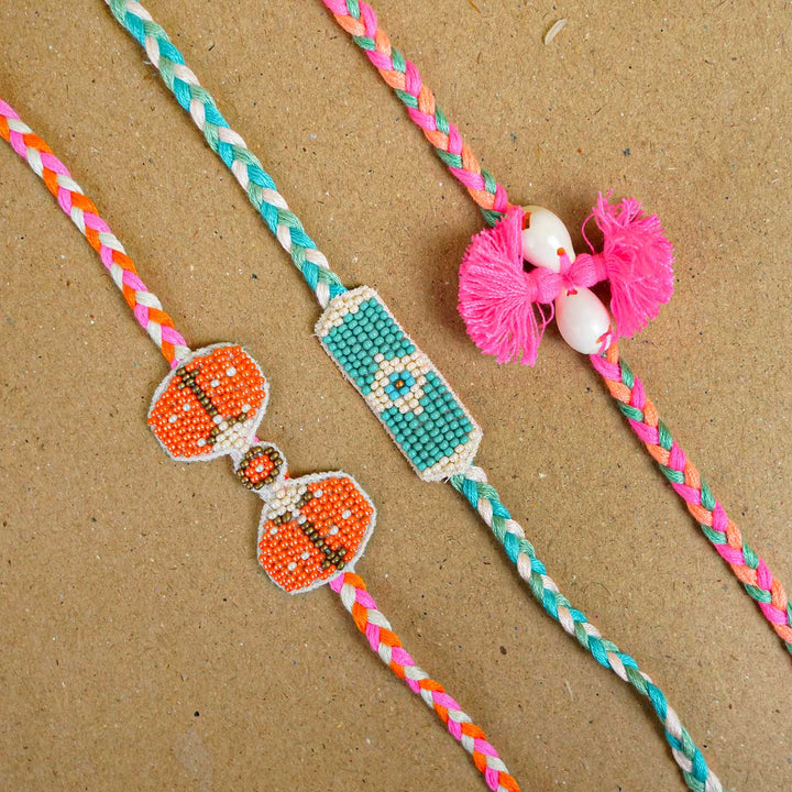 Reusable Beaded Orange Bug Rakhi With Roli Chawal - Group of three beaded rakhis