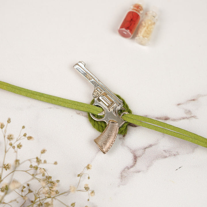 Handmade Gun Shaped Metal Rakhi For Brother