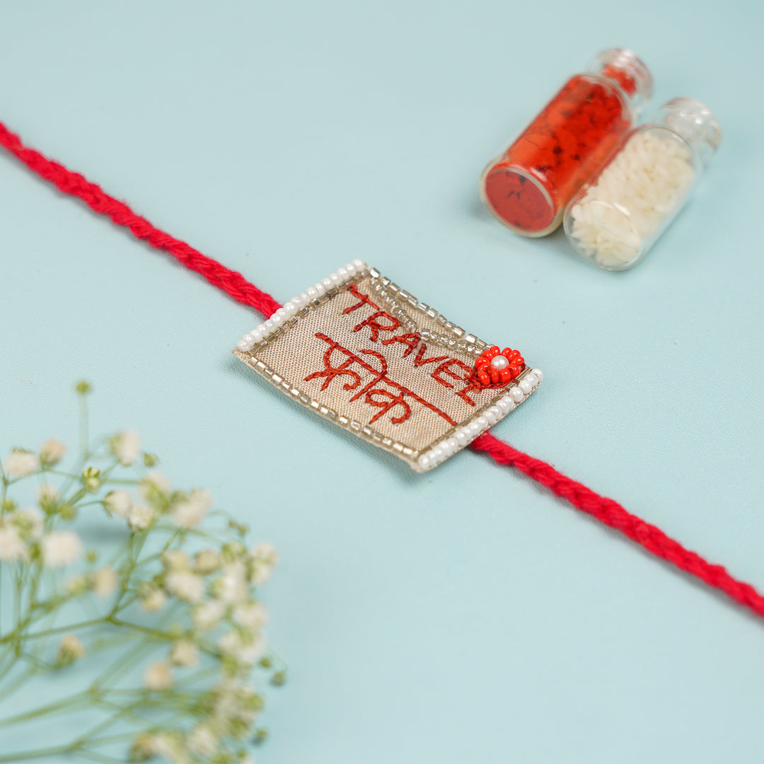 Handmade Beaded Travel Freak Bhaiya Bhabhi Rakhi With Roli Chawal - Close-up Back View