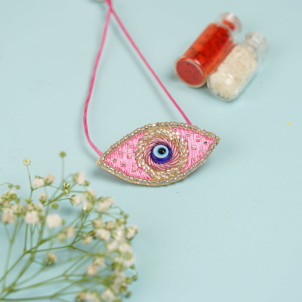 Handmade Beaded Evil Eye Lumba Rakhi For Bhabhi With Roli Chawal - Close-up Front View