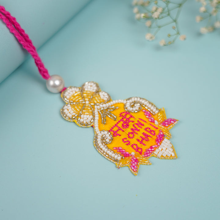 Handmade Beaded Sabse Sona Bhabhi Lumba Rakhi For Bhabhi With Roli Chawal - Angled Side View Showing Details