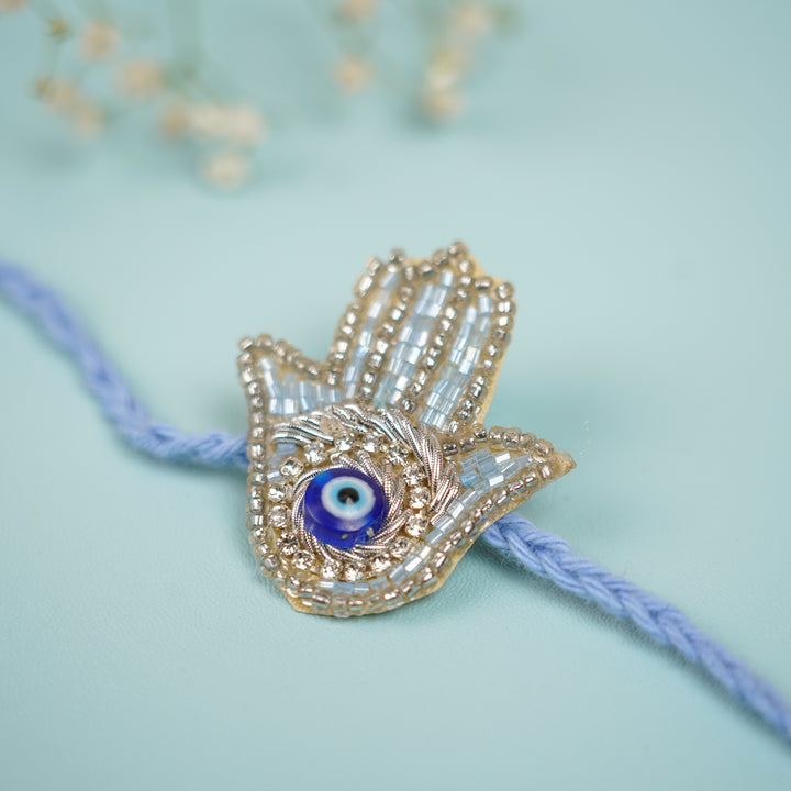 Handmade Beaded Evil Eye Hamsa Hand Rakhi With Roli Chawal - Beaded Charm Detail