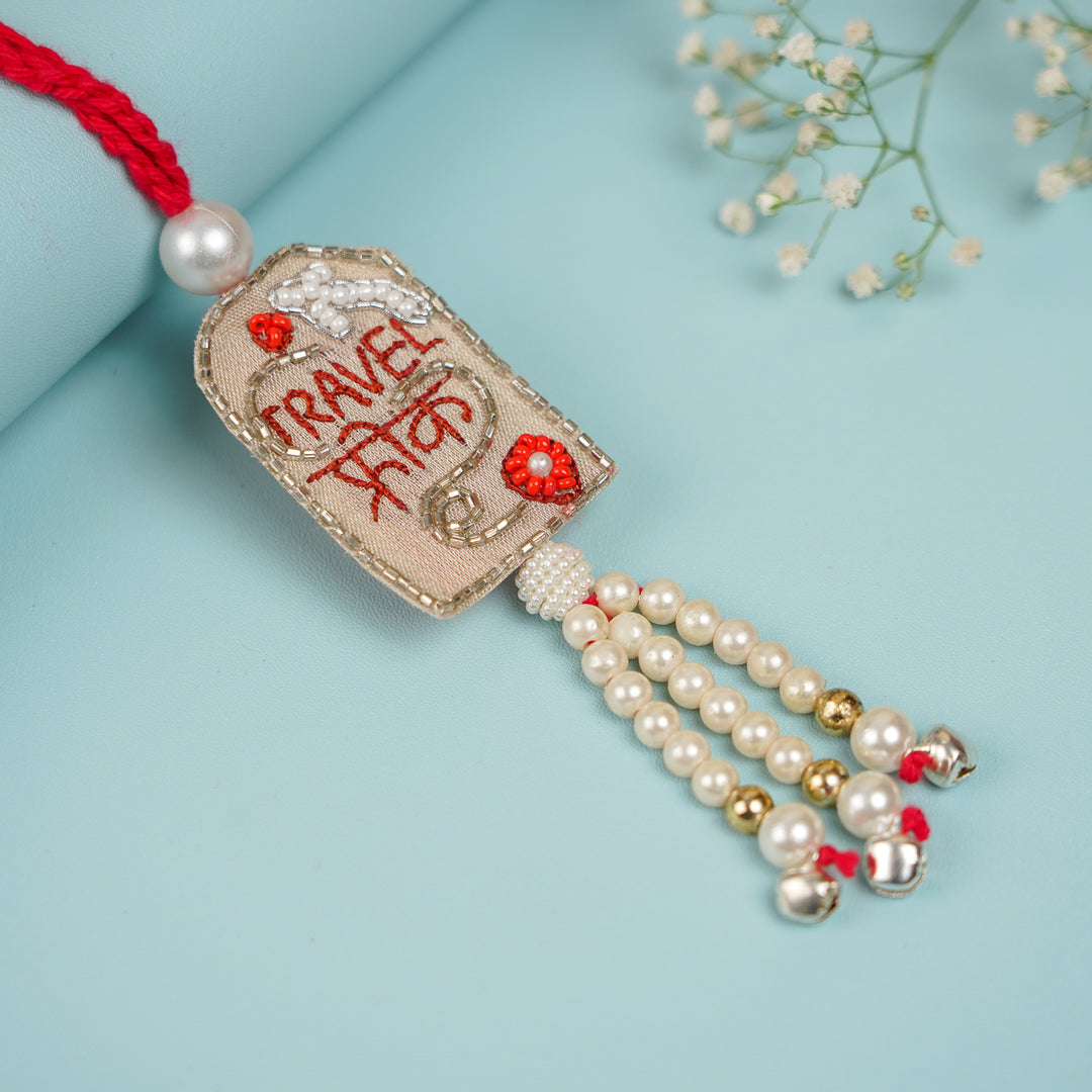 Handmade Beaded Travel Freak Lumba Rakhi For Bhabhi With Roli Chawal - Flat Lay Showing Entire Tassel