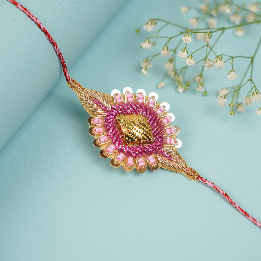 Handmade Gota Patti Design Rakhi With Roli Chawal For Brother And Sisters - Close-up of Rakhi Design