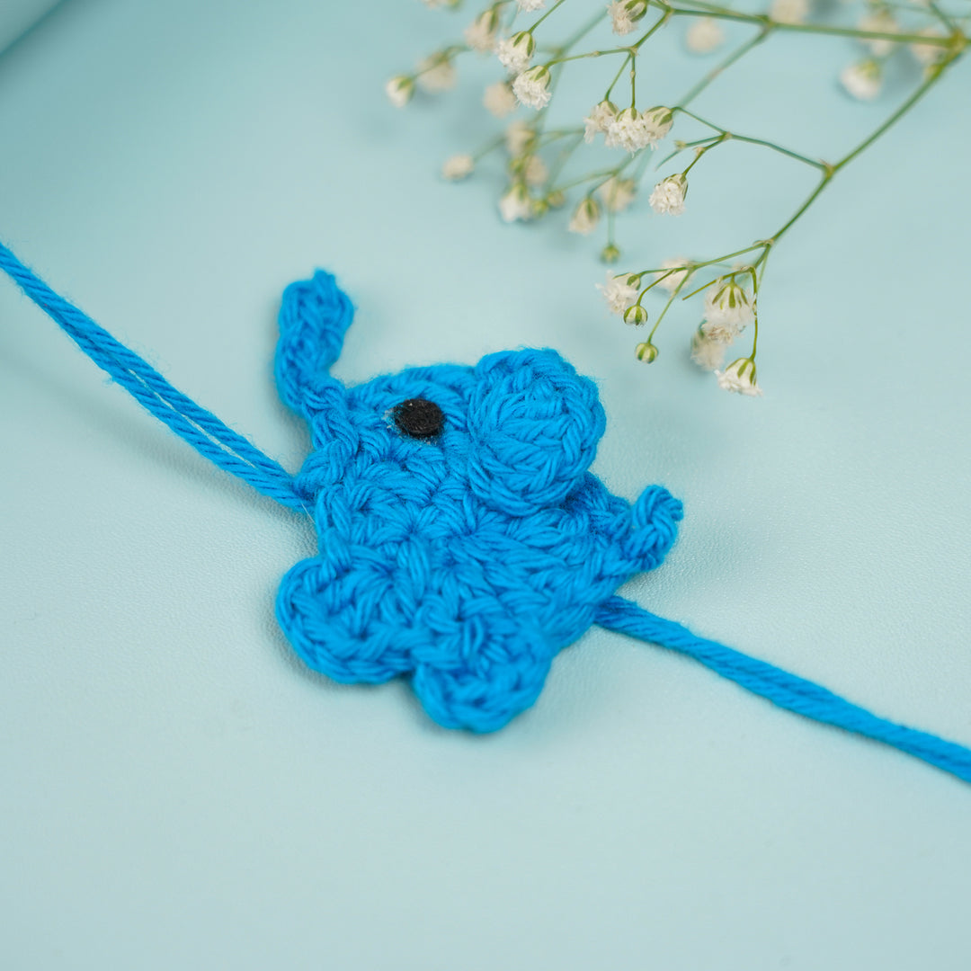 Customized Handmade Crochet Elephant Theme Rakhi With Roli Chawal - Blue Rakhi with Decorative Flowers
