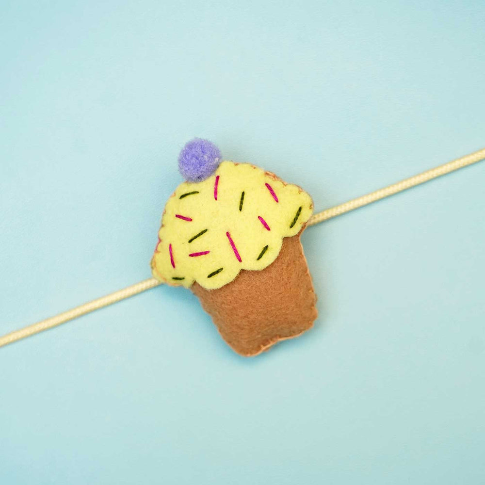 Handmade Cupcake Felt Rakhi With Roli Chawal - Close-up of Cupcake Rakhi