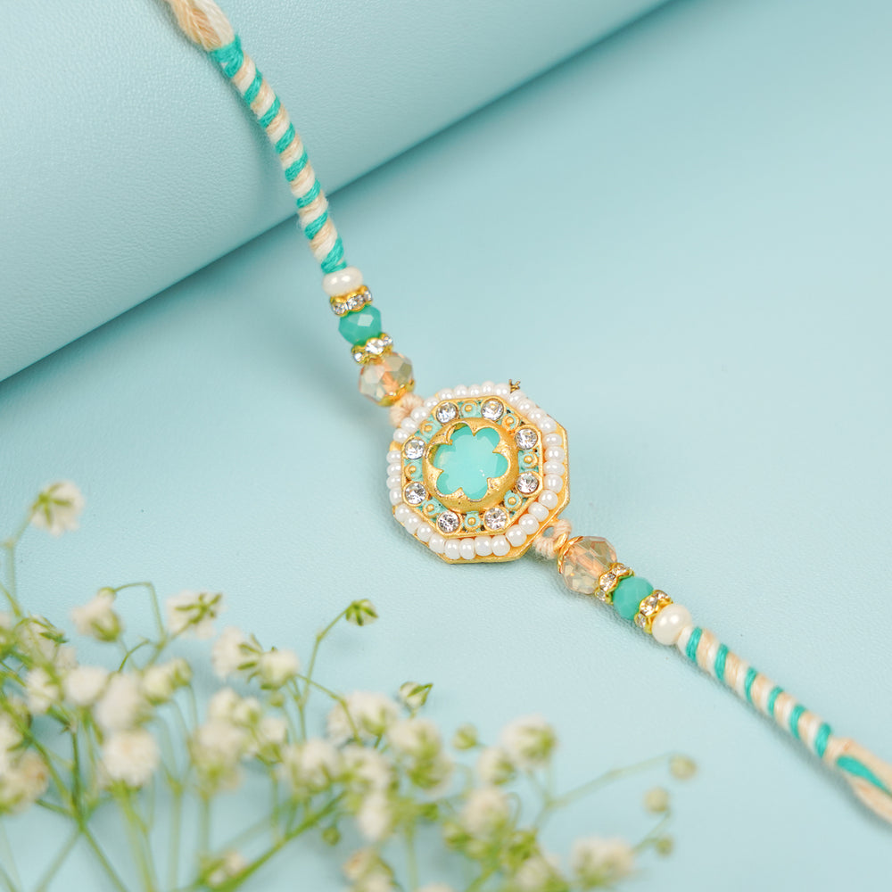 Handmade Sea Green Jadtar Bhaiya Bhabhi Rakhi With Roli Chawal Set Of 2 - Front View with Decorative Flowers