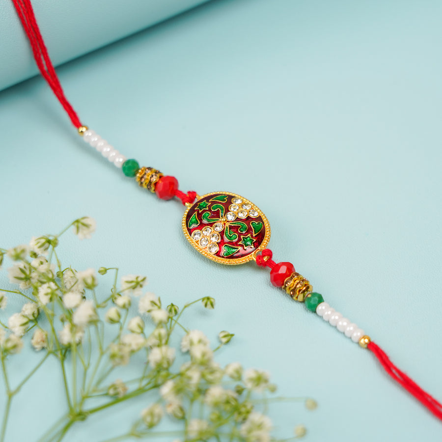 Handmade Red Oval Jadtar Rakhi With Roli Chawal - Close-up of Rakhi Bracelet