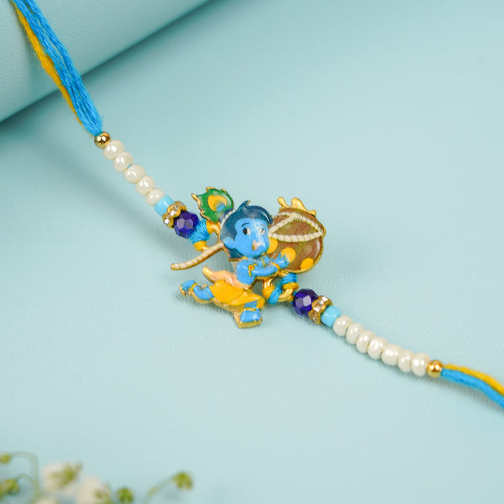 Handmade Baal Krishna Rakhi With Roli Chawal - Close-up of central charm