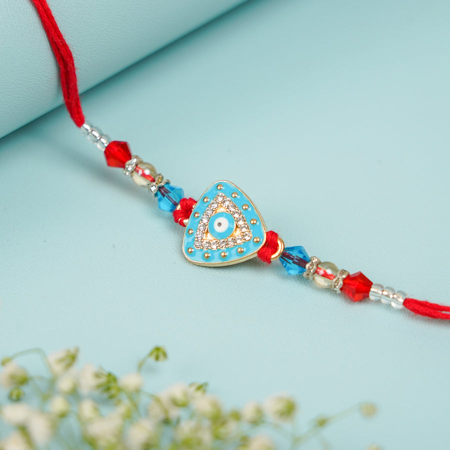 Handmade Triangle Evil Eye Rakhi With Roli Chawal - Close-up of central pendant detail