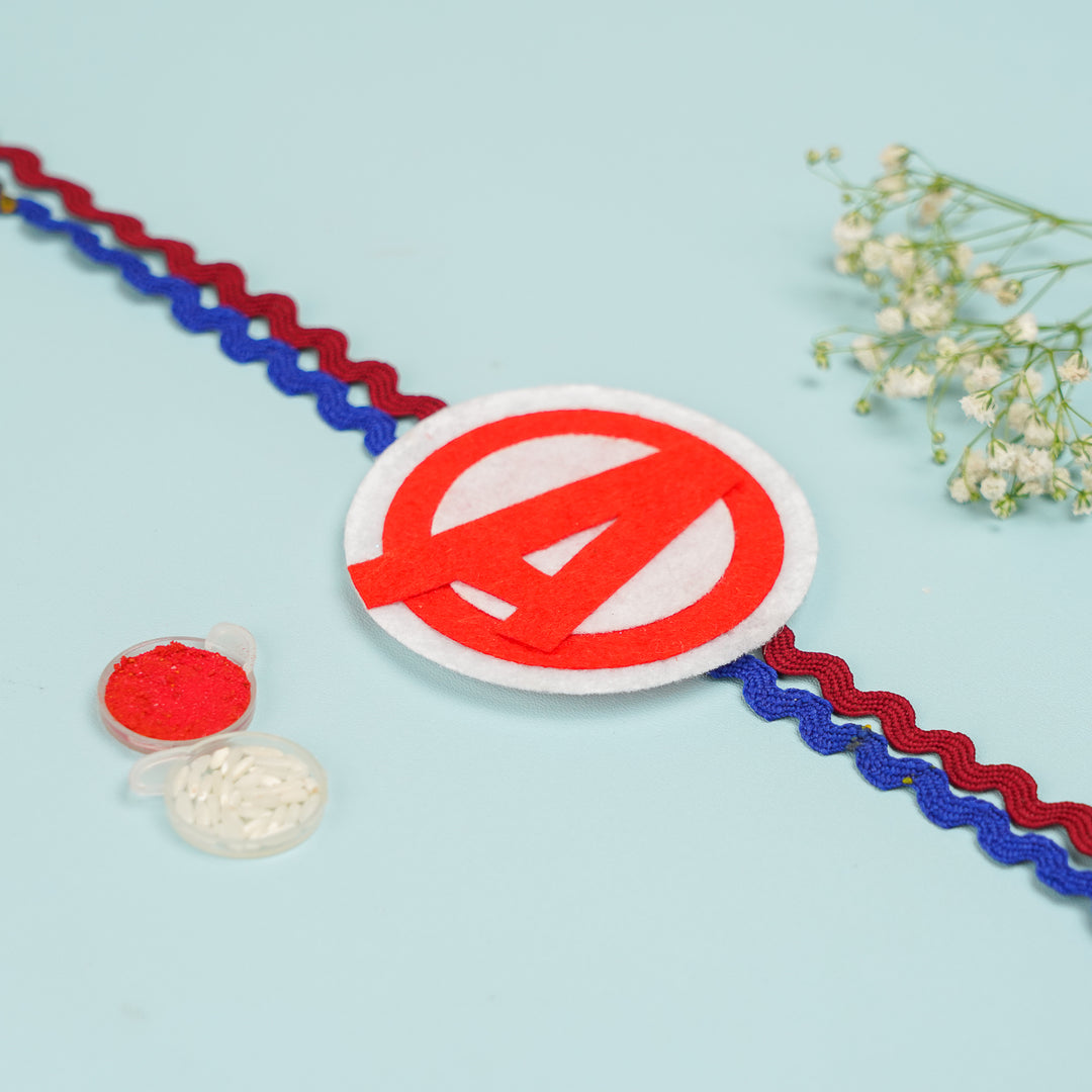 Handmade Avengers Theme Felt Kids Rakhi With Roli Chawal - Front View with Pooja Items Nearby