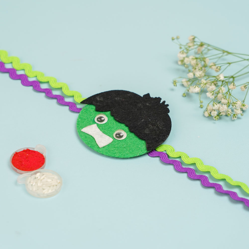 Handmade Hulk Theme Felt Kids Rakhi With Roli Chawal 2 - Flat Lay View with Accessories