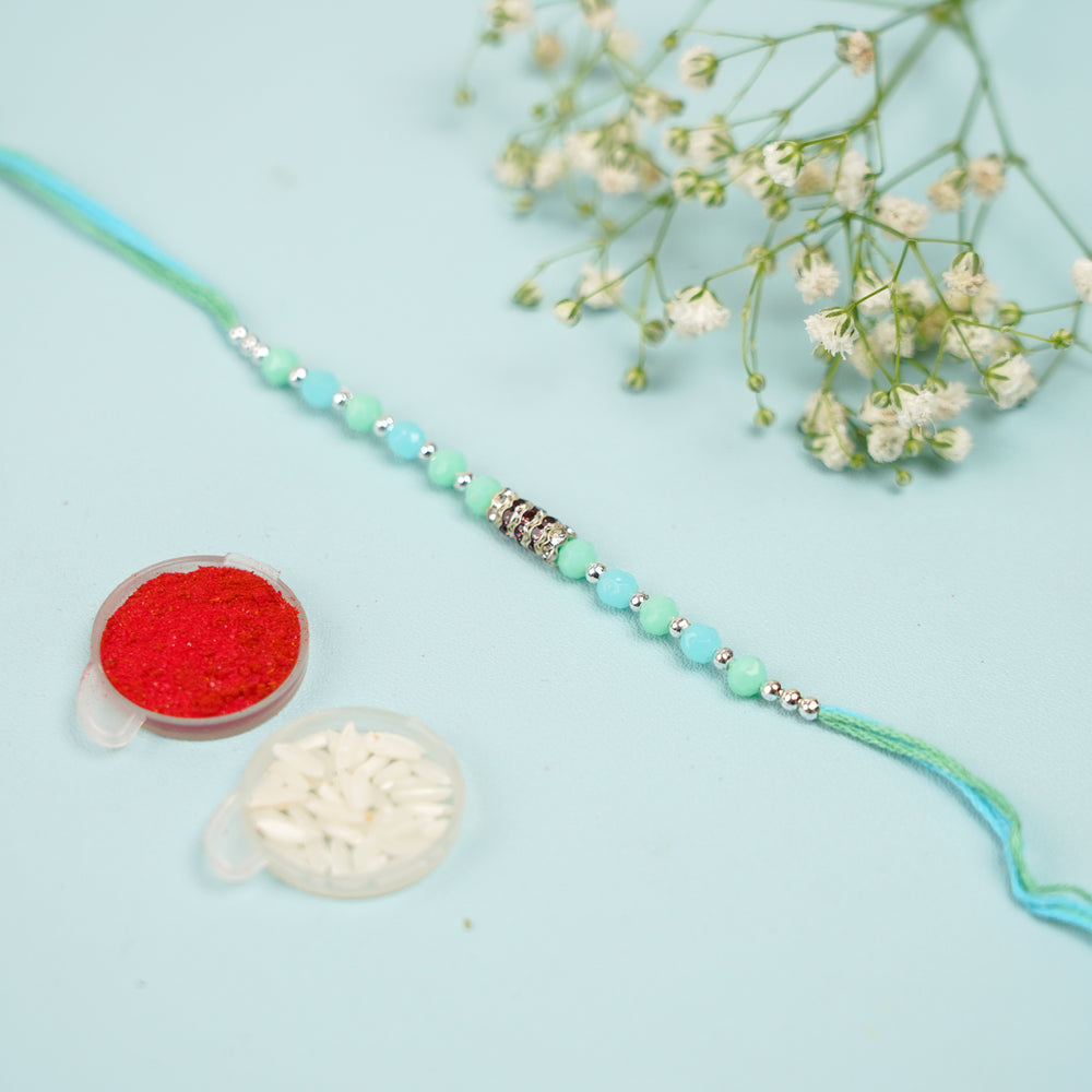Handmade Beaded Sea Green Rakhi With Roli Chawal Set Of 2 - Single bracelet with red and rice powders