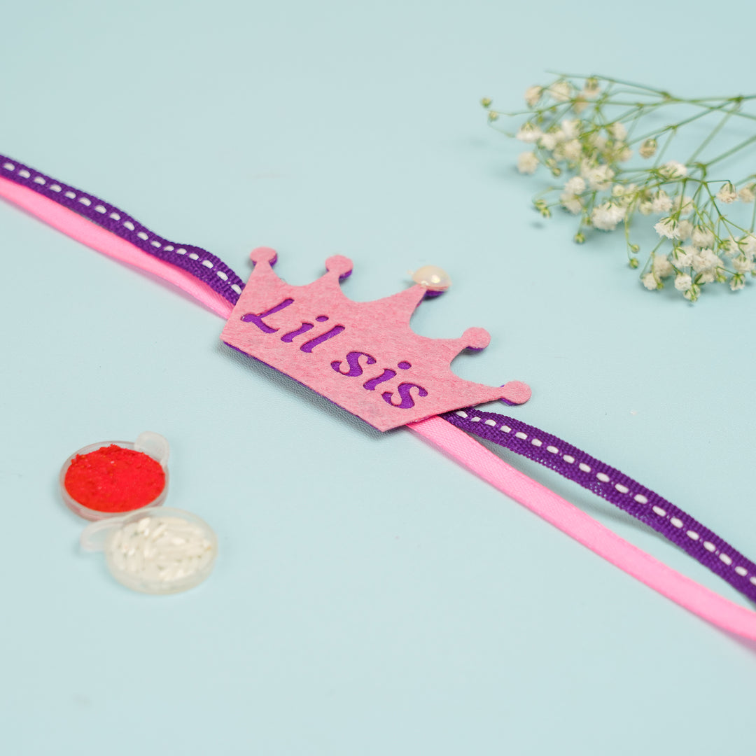 Handmade Crown Theme Lil Sis Felt Kids Rakhi With Roli Chawal - Flat Lay with Craft Supplies