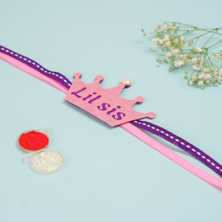 Handmade Crown Theme Lil Sis Felt Kids Rakhi With Roli Chawal - Flat Lay with Craft Supplies