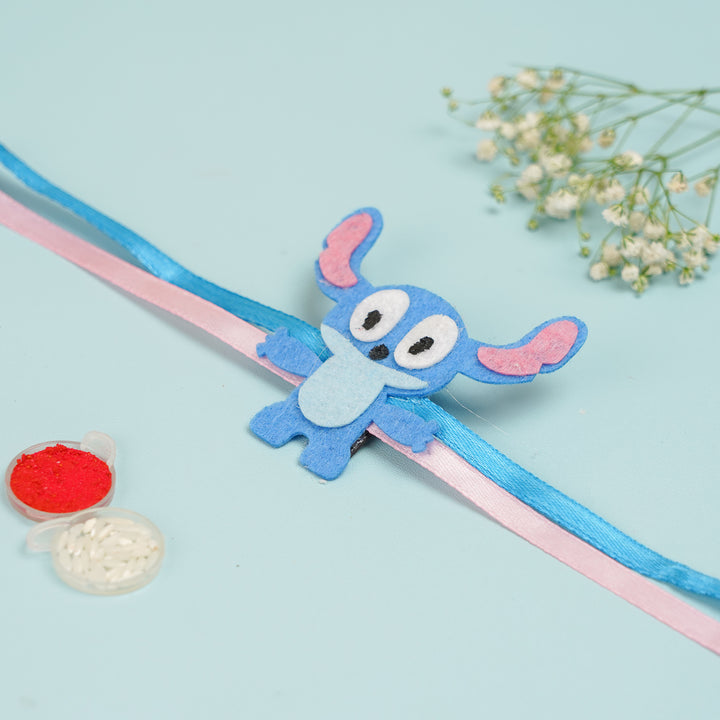 Handmade Stitch Theme Felt Kids Rakhi With Roli Chawal - Flat Lay Display with Accessories