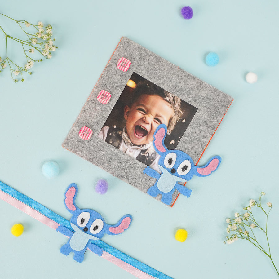 Photo Personalized Stitch Theme Felt Rakhi Hamper With Roli Chawal Includes 1 Magnetic Photo Frame 1 Rakhi - Flat Lay with Photo Frame and Ribbon