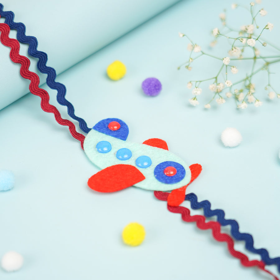 Handmade Aeroplane Theme Felt Kids Rakhi With Roli Chawal - Close-up of Airplane Decoration