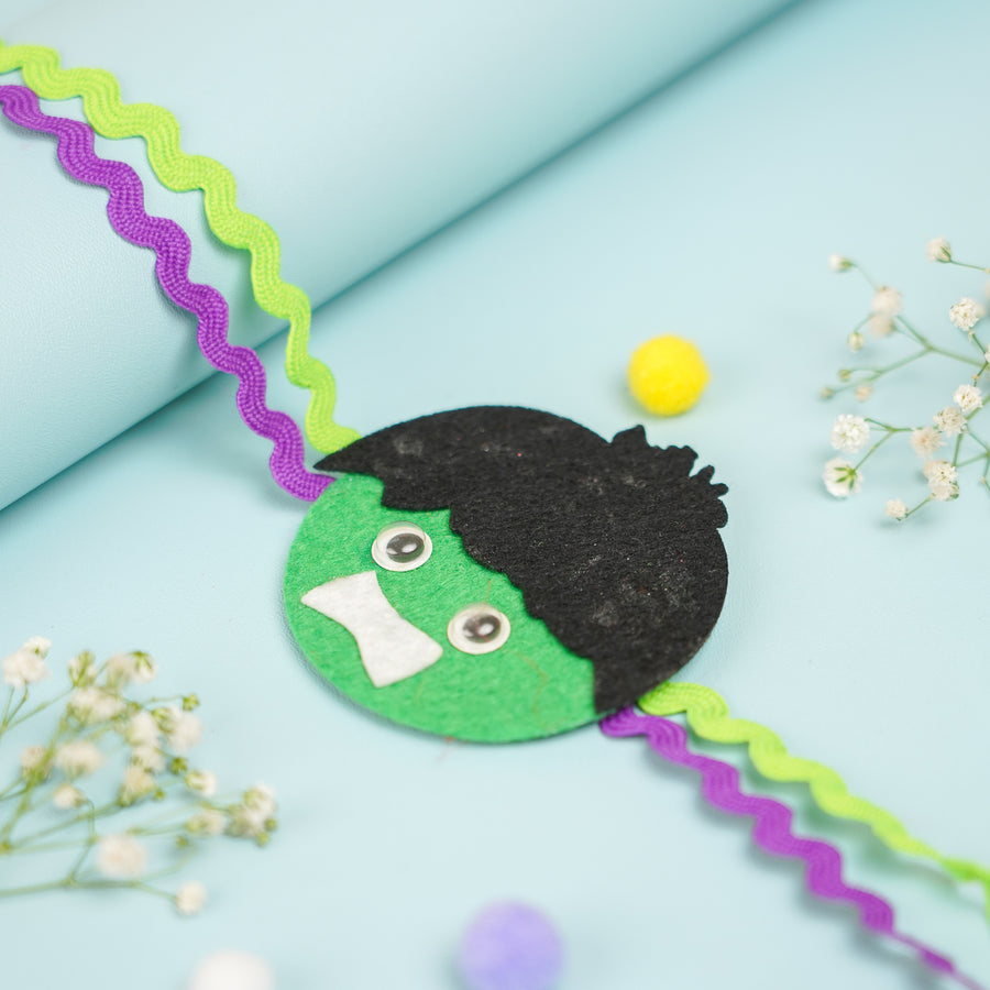 Handmade Hulk Theme Felt Kids Rakhi With Roli Chawal 2 - Close-up Top Angle View