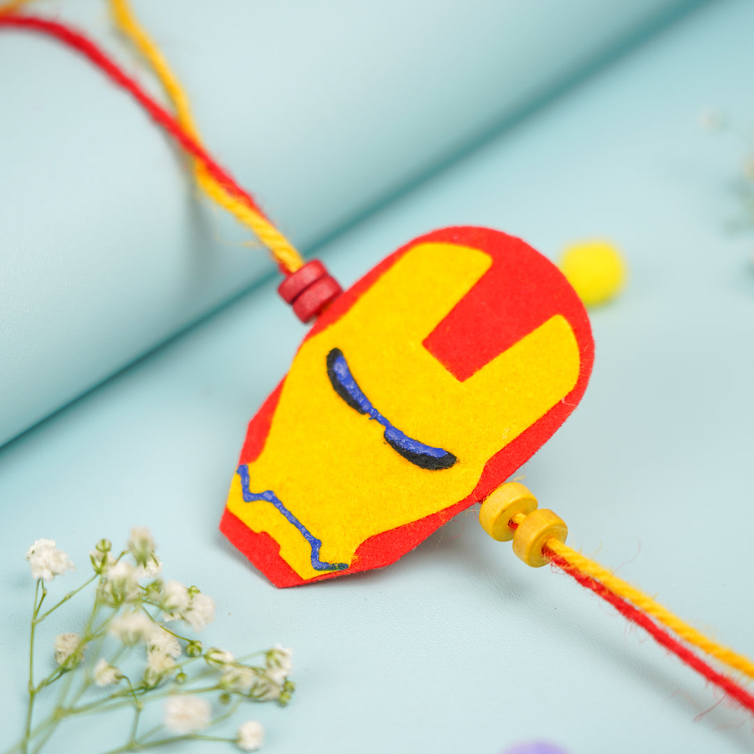 Handmade Iron Man Theme Felt Kids Rakhi With Roli Chawal 2 - Close-up of Central Design