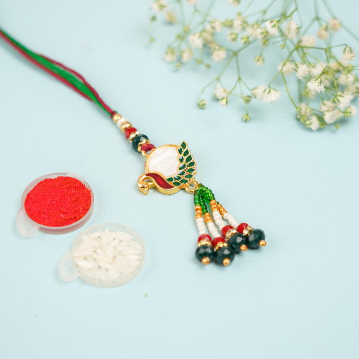 Handmade Beaded Peacock Bhaiya Bhabhi Rakhi With Roli Chawal Set Of 2 - Single Bracelet with Rice and Red Powder Close-up
